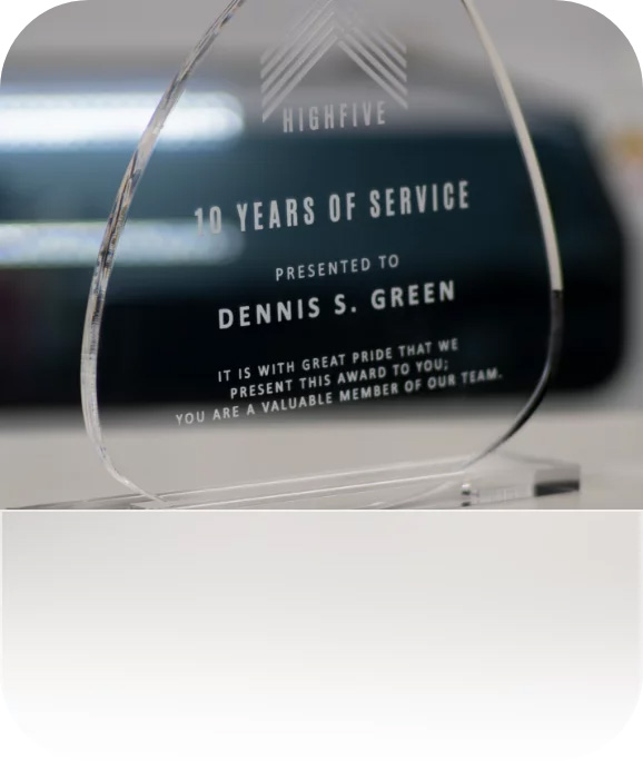 A laser-cut and engraved award made of acrylic.