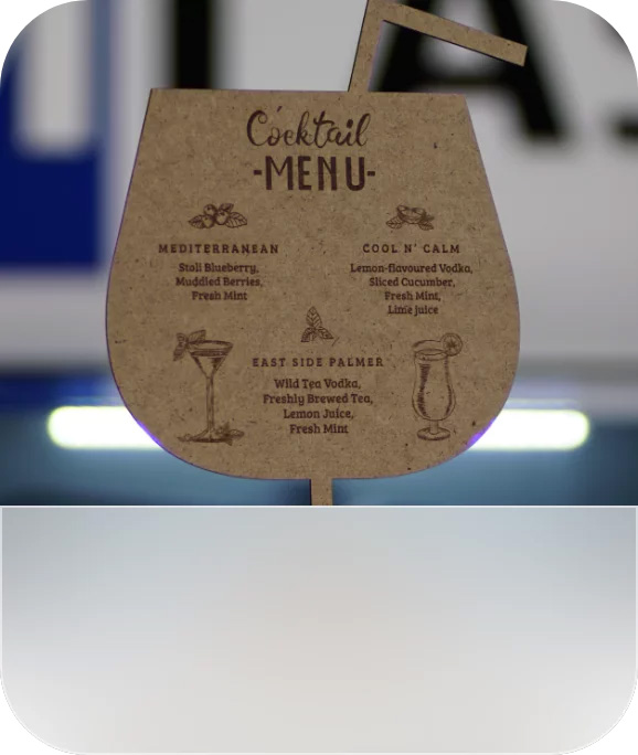 A menu card made of hardboard, laser engraved and cut.