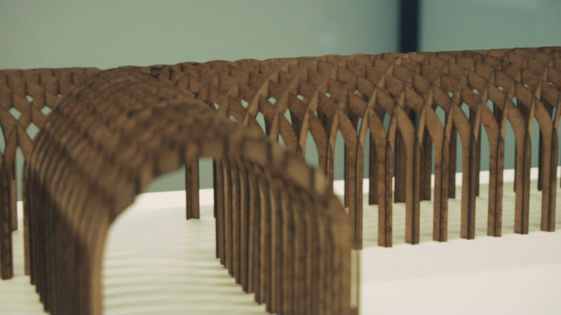 A model of a covered bridge made of wood cut with the laser machine