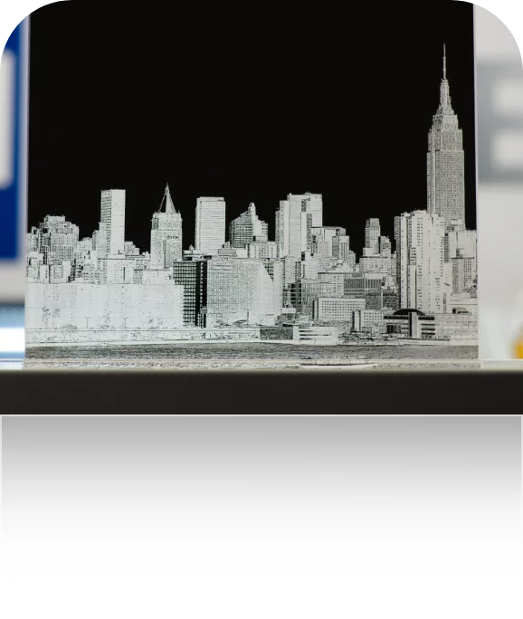 A laser-engraved skyline on a mirror.