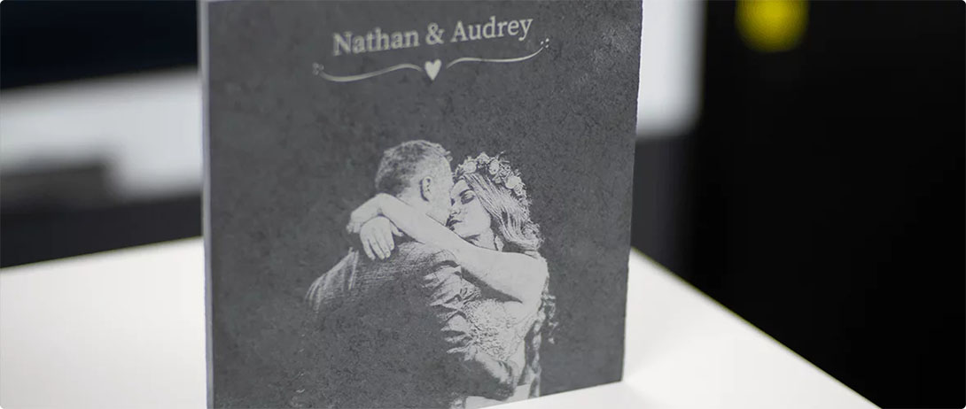 Natural stone with an engraving and names of a bridal couple.
