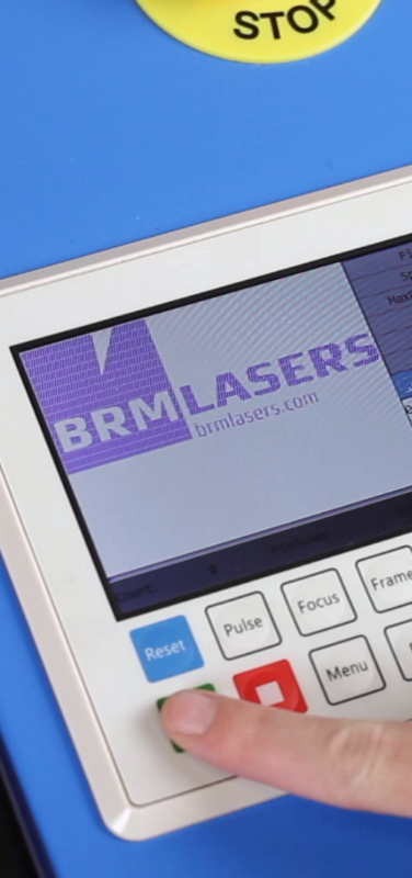 The control panel of a BRM Pro laser machine with the BRM Lasers logo in view.